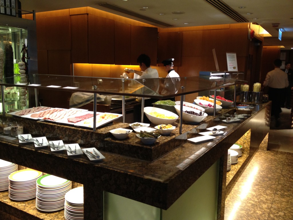 Sliced meats on the left, fruits and smoothies on the right.